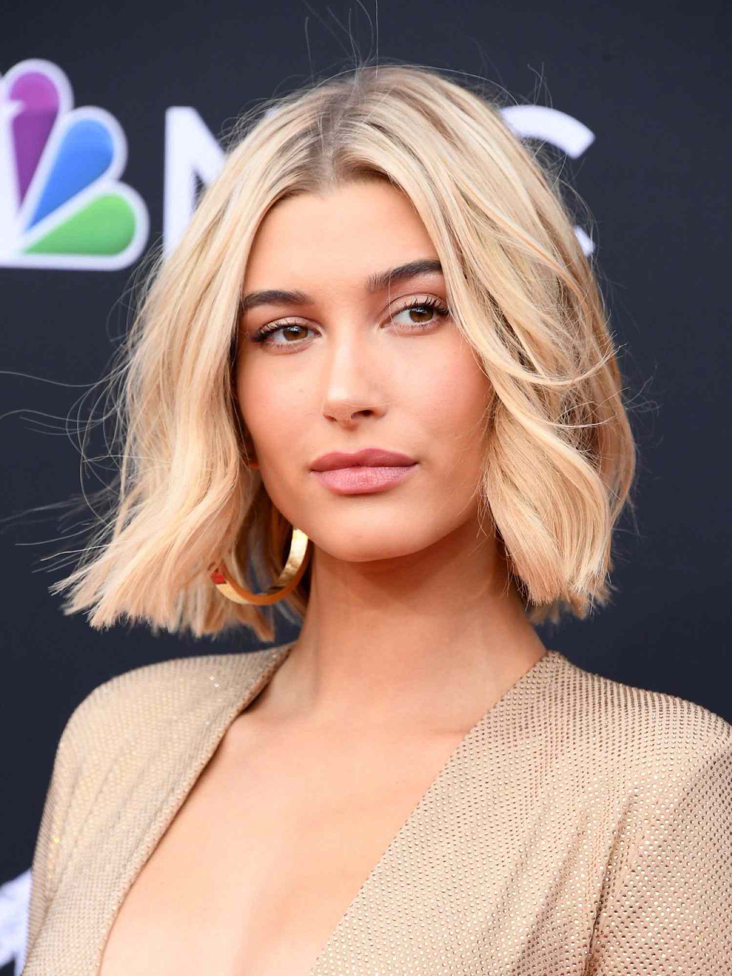 Close up of Hailey Bieber with a blonde bob hairstyle