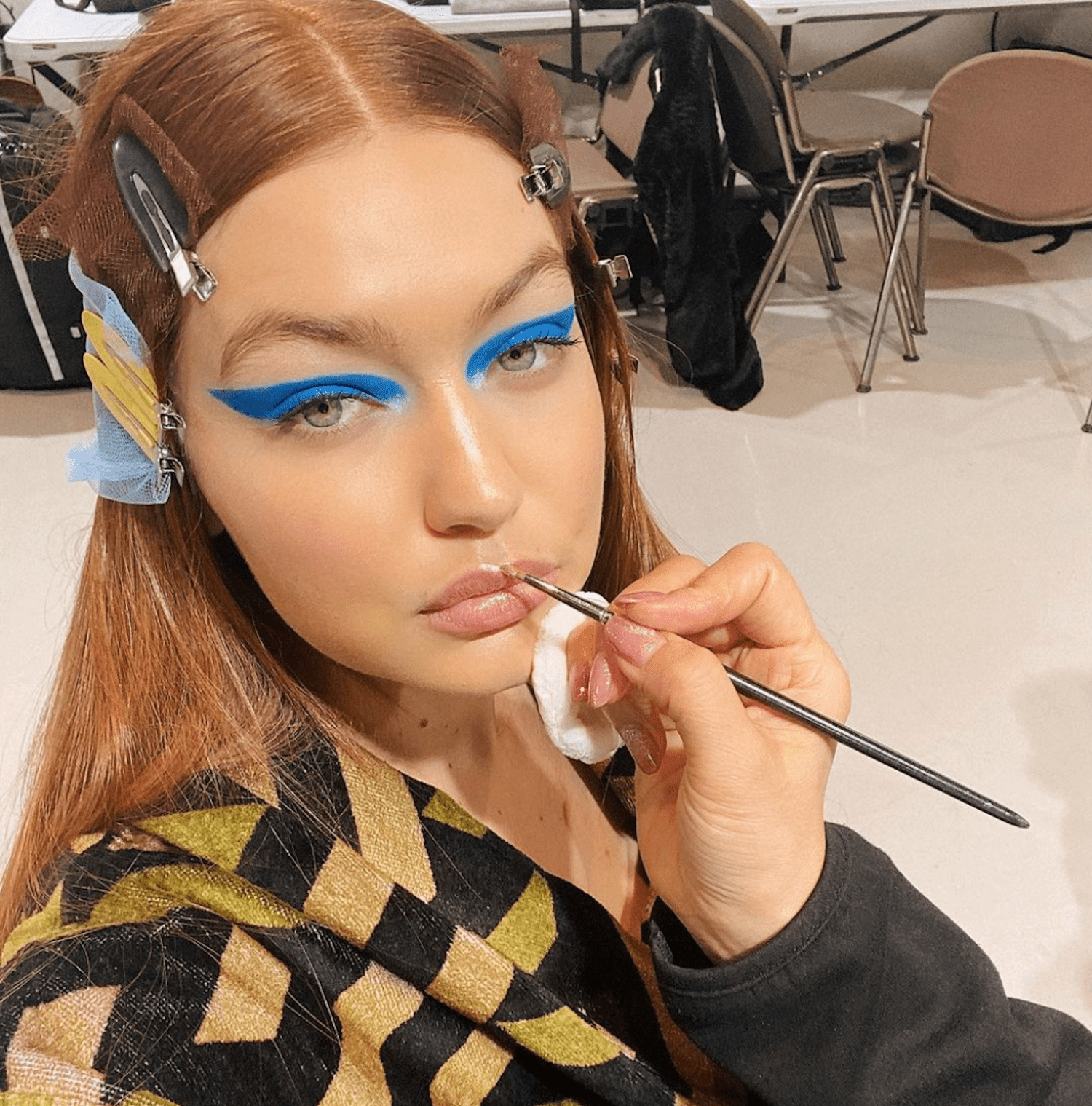 GIGI HADID GETS HER HAIR AND MAKEUP DONE BACKSTAGE AT FASHION WEEK