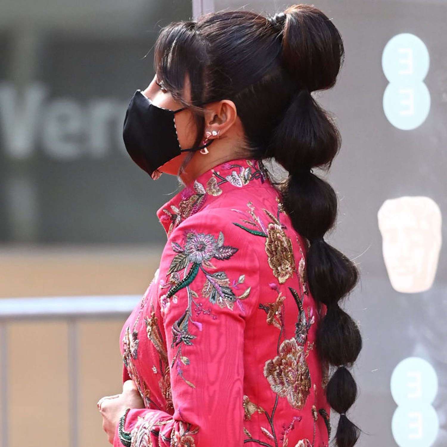 Priyanka Chopra in profile, her hair in a long, thick bubble ponytail