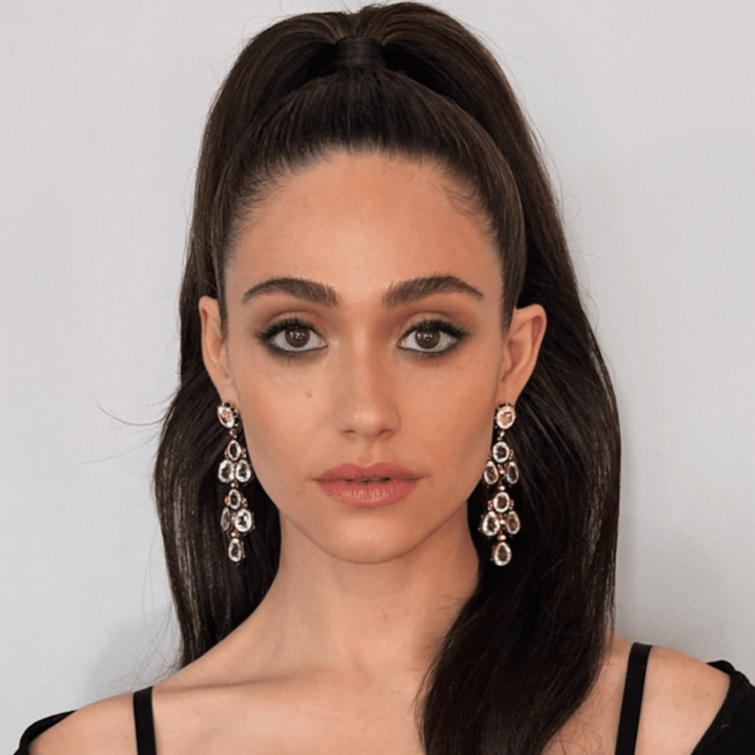 Emmy Rossum wears her long espresso brunette hair in a high ponytail