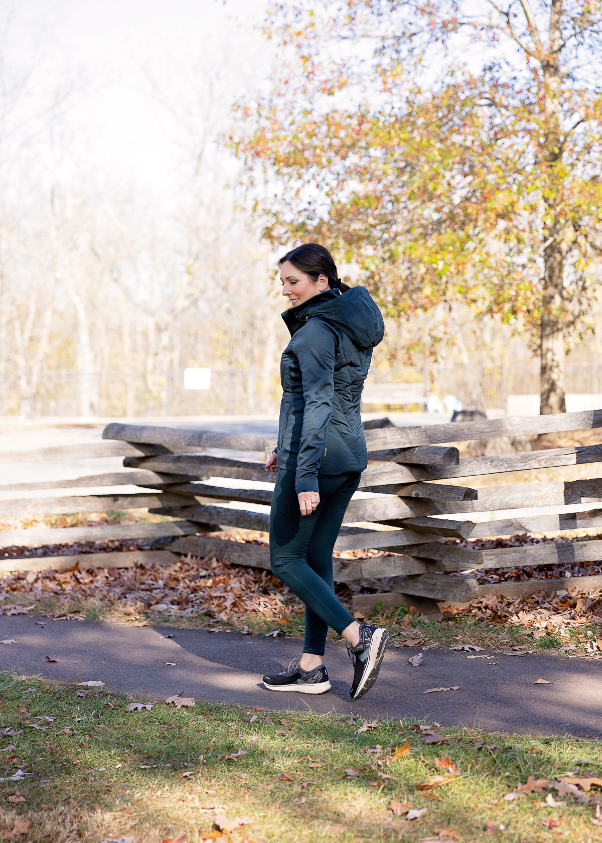 Jo-Lynne Shane wearing the Athleta Altitude Fleece Lined Stash High Rise Leggings with the Athleta Inlet Jacket in Cypress at Valley Forge National Park