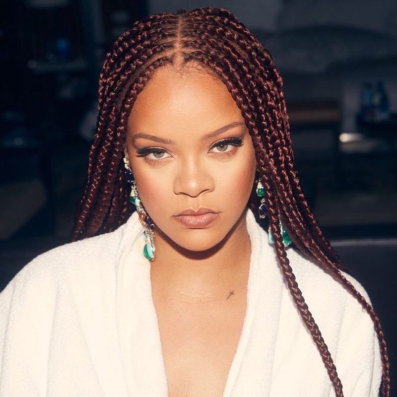 Rihanna wears long burgundy red box braids with center part