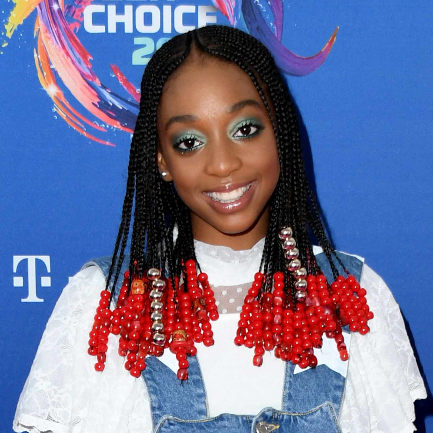 Eris Baker attends Teen Choice Awards with heavily beaded braids