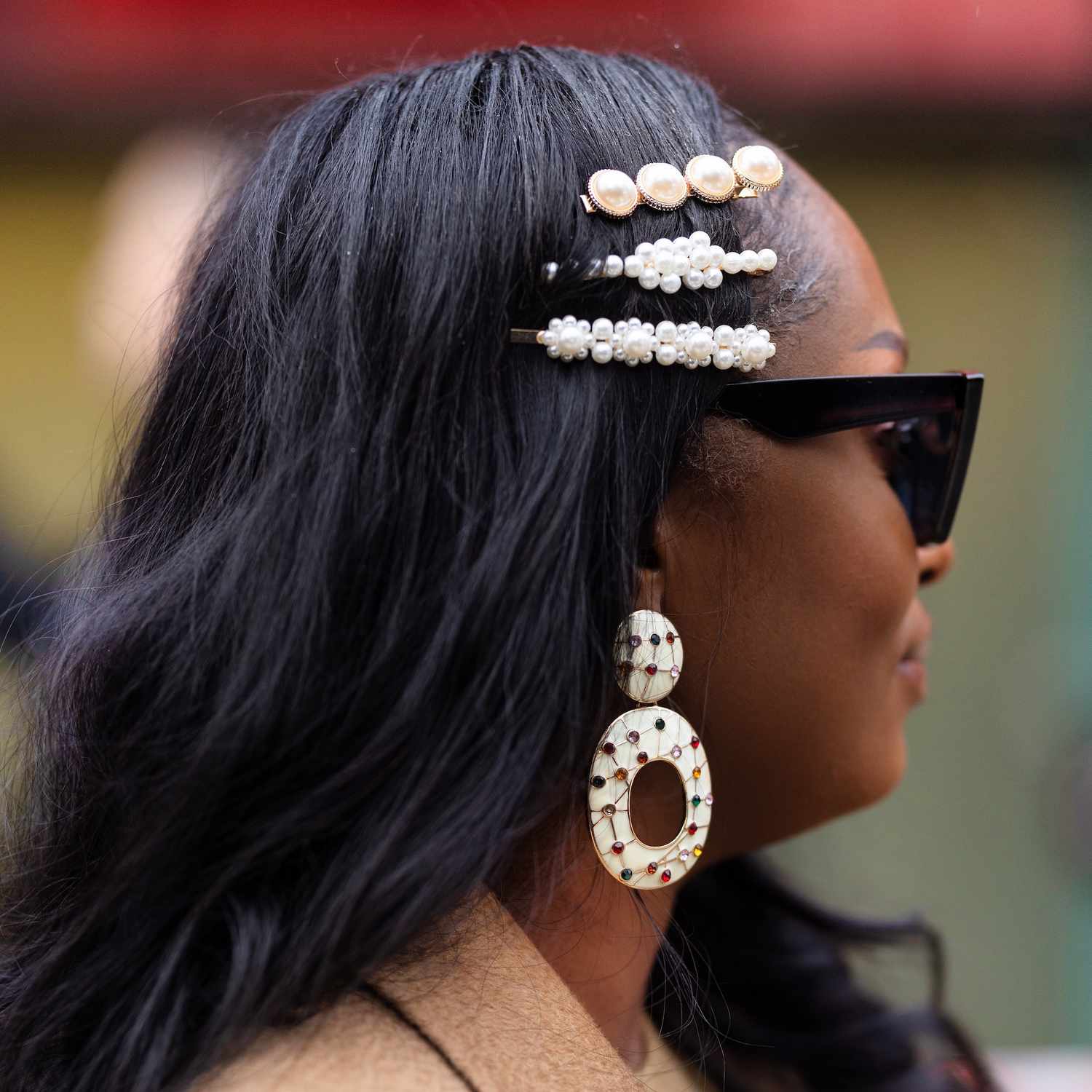 A guest at Milan Fashion Week wears a variation of three stacked pearl bobby pins