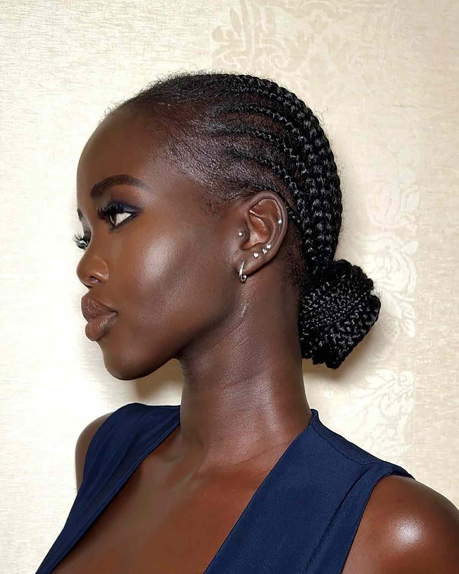 model adut aketch with straightback braids